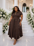 Brown flowing wide-leg trousers with decorative eyelet straps and pointed hemline