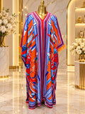 Multicolour scarf-print maxi kaftan with V-neck and orange fringe sleeves on a mannequin
